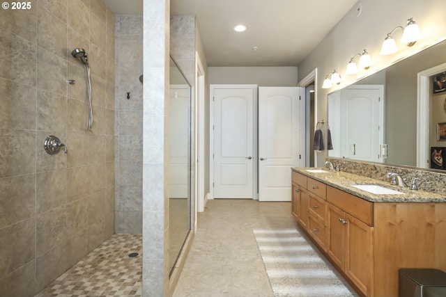 707 N Hayden Island Dr Unit 413, Portland, OR 97217 - full bath with recessed lighting, double vanity, tiled shower, and a sink