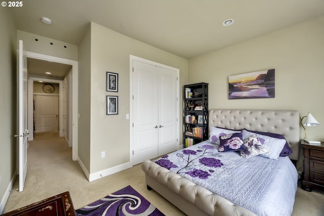 707 N Hayden Island Dr Unit 413, Portland, OR 97217 - bedroom featuring baseboards, carpet flooring, recessed lighting, and a closet