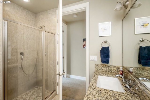 707 N Hayden Island Dr Unit 413, Portland, OR 97217 - full bathroom featuring baseboards, vanity, and a stall shower