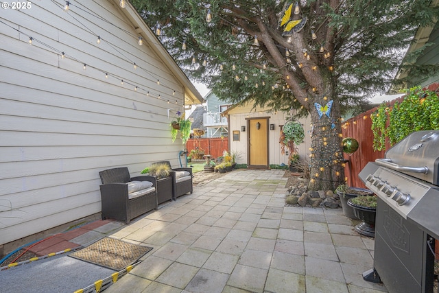 view of patio / terrace with an outdoor structure and grilling area