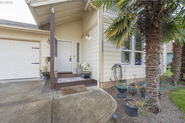 doorway to property featuring a garage