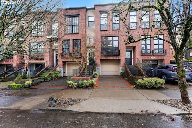 view of front facade featuring a garage, concrete driveway, and brick siding