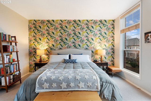 carpeted bedroom with wallpapered walls and baseboards