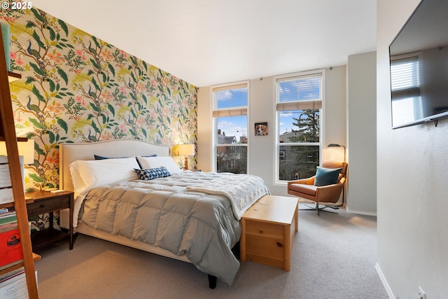 carpeted bedroom with baseboards