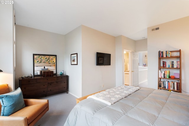 bedroom with baseboards, visible vents, ensuite bath, and carpet flooring