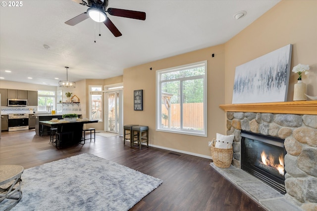 18211 NE 32nd St, Vancouver, WA 98682 - living area with recessed lighting, visible vents, a stone fireplace, and wood finished floors
