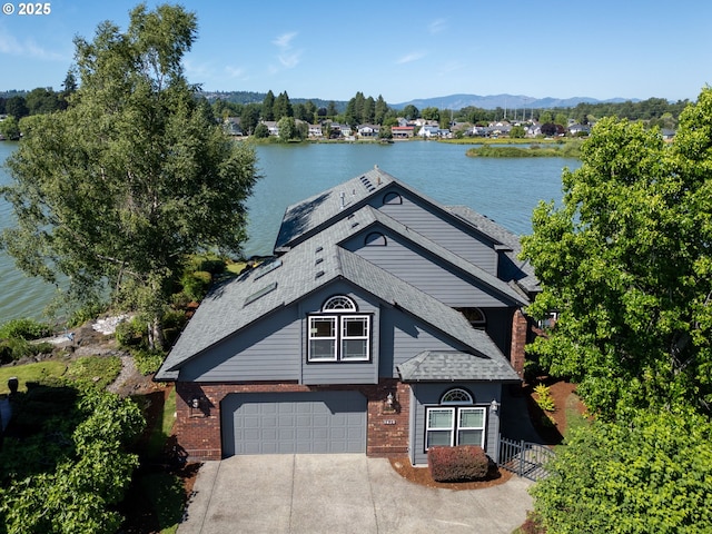 21401 NE Shore Dr, Fairview, OR 97024 - view of front of property featuring a water view, concrete driveway, and brick siding