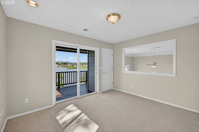 21401 NE Shore Dr, Fairview, OR 97024 - carpeted spare room with ceiling fan, a textured ceiling, and a smoke detector