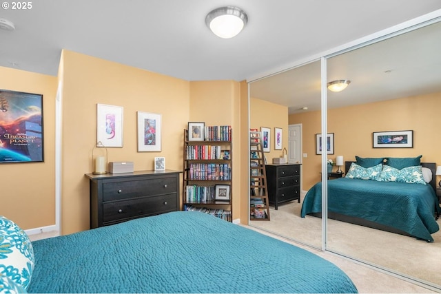 bedroom featuring carpet and baseboards