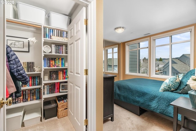 bedroom with carpet floors and visible vents