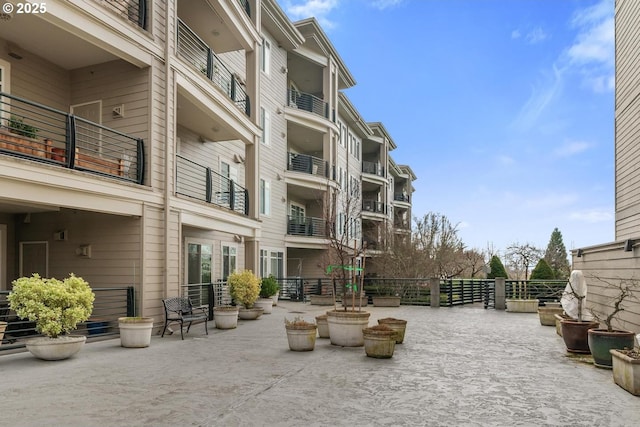 view of home's community with a patio area