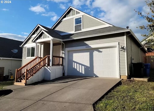 view of front facade with concrete driveway and an attached garage