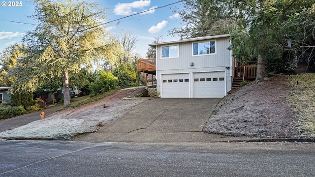 view of front of house featuring a garage and a deck