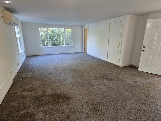 3208 W 7th St, The Dalles, OR 97058 - interior space with a wall unit AC, carpet flooring, and baseboards