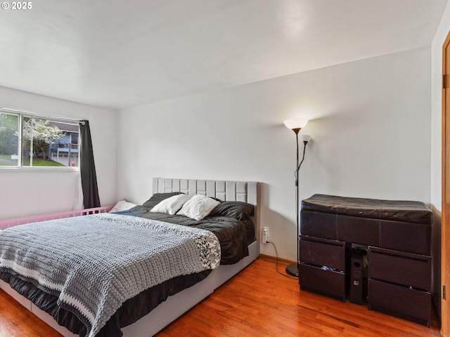 bedroom with wood finished floors