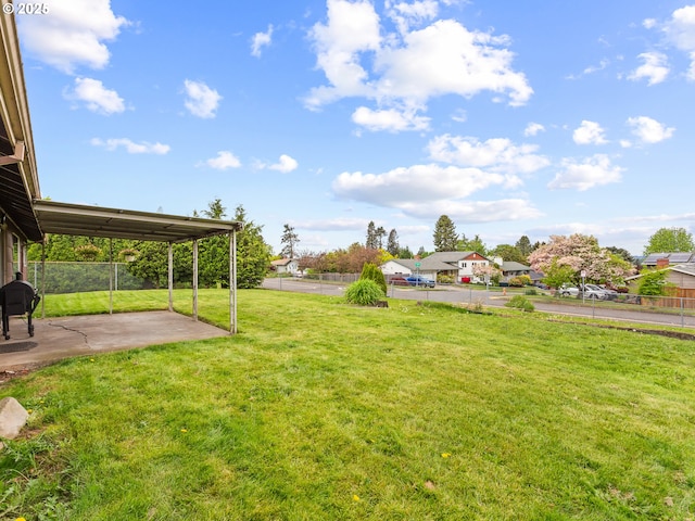 view of yard featuring fence and a patio area