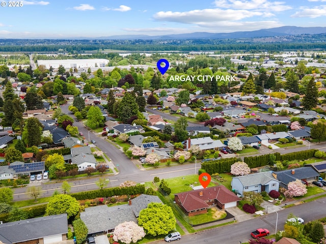 drone / aerial view with a mountain view and a residential view