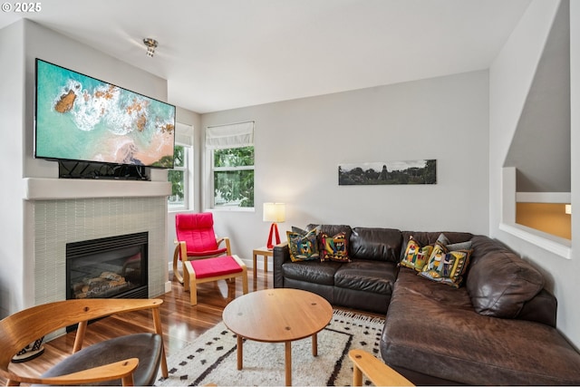 16040 SW Audubon St Unit 101, Beaverton, OR 97003 - living area featuring wood finished floors and a glass covered fireplace
