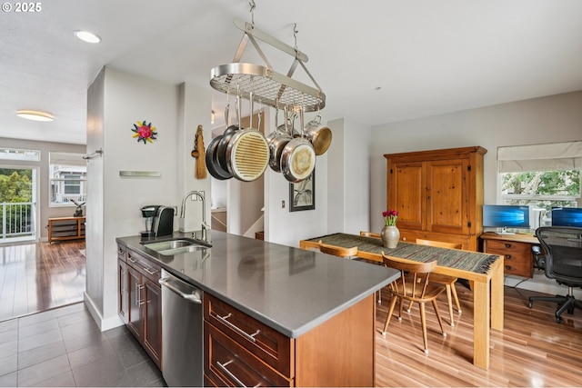 16040 SW Audubon St Unit 101, Beaverton, OR 97003 - kitchen with dishwasher, healthy amount of natural light, a desk, and dark countertops