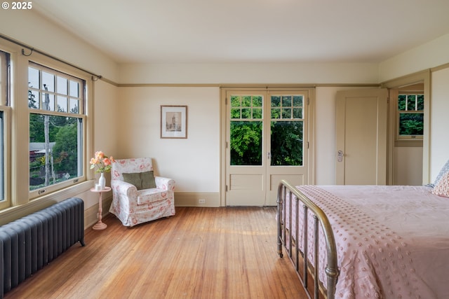 1343 Jerome Ave, Astoria, OR 97103 - bedroom with radiator and wood-type flooring