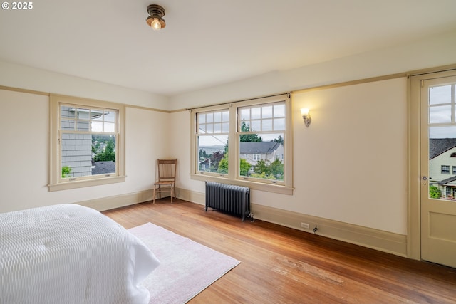 1343 Jerome Ave, Astoria, OR 97103 - bedroom featuring radiator heating unit and light wood-style floors