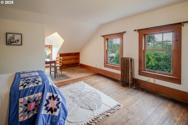 1343 Jerome Ave, Astoria, OR 97103 - bedroom with radiator, hardwood / wood-style floors, and lofted ceiling