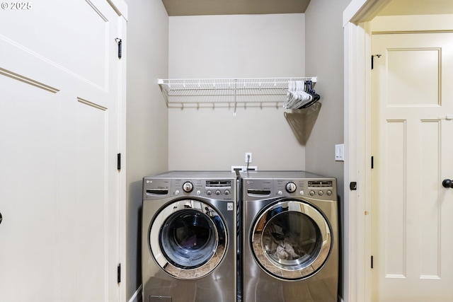 washroom with laundry area and independent washer and dryer