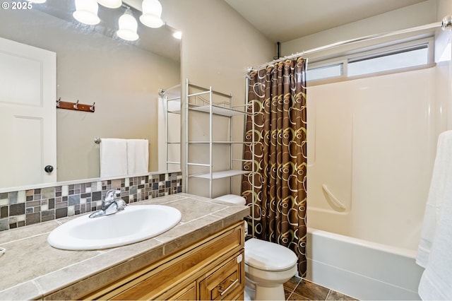 full bathroom featuring tile patterned floors, shower / bathtub combination with curtain, toilet, decorative backsplash, and vanity