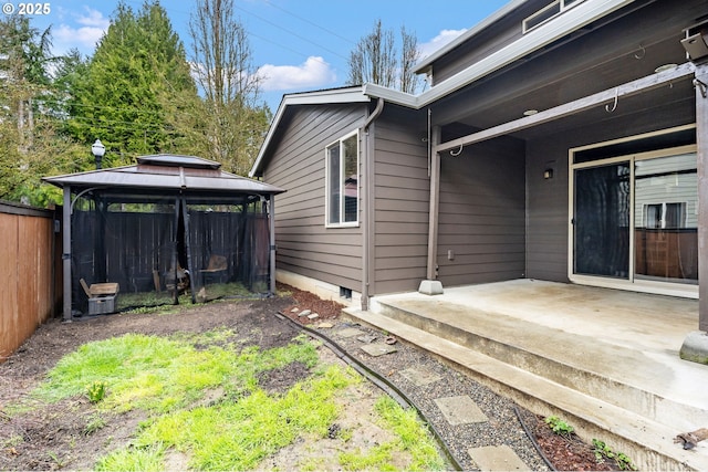 exterior space with a gazebo, a patio, and fence