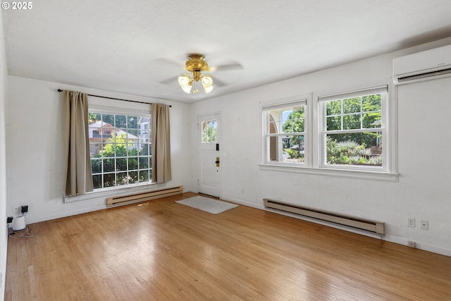 2000 Harney St, Vancouver, WA 98660 - entryway with a baseboard heating unit, ceiling fan, a wall mounted AC, and wood finished floors