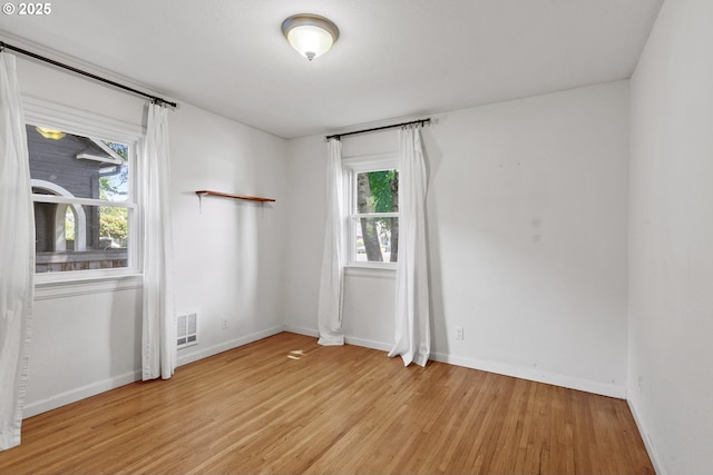 2000 Harney St, Vancouver, WA 98660 - empty room with light wood-style flooring and baseboards