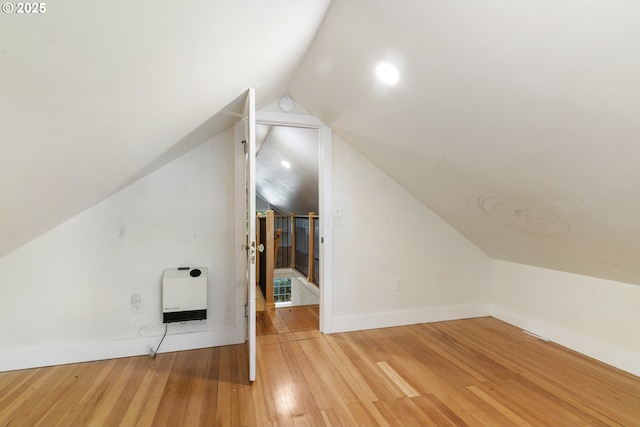 2000 Harney St, Vancouver, WA 98660 - additional living space with heating unit, lofted ceiling, and hardwood / wood-style flooring