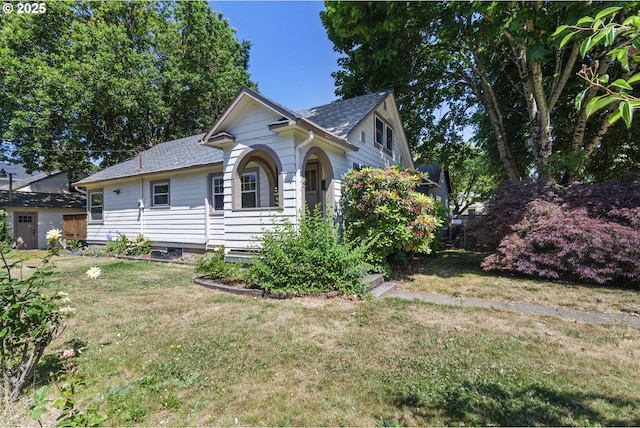 2000 Harney St, Vancouver, WA 98660 - view of front facade with a front yard, roof with shingles, and a shed