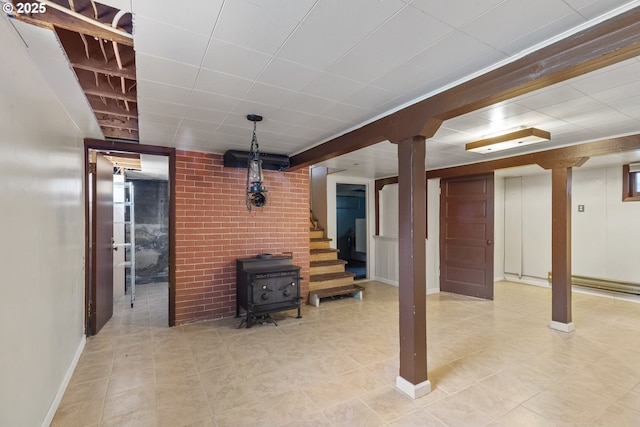 2000 Harney St, Vancouver, WA 98660 - finished below grade area with a wood stove, tile patterned flooring, and stairway