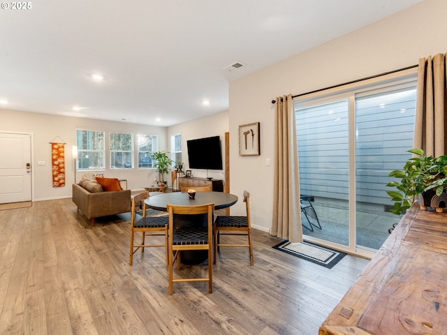 dining area with light hardwood / wood-style flooring