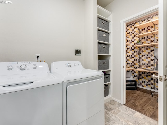 washroom featuring washing machine and clothes dryer