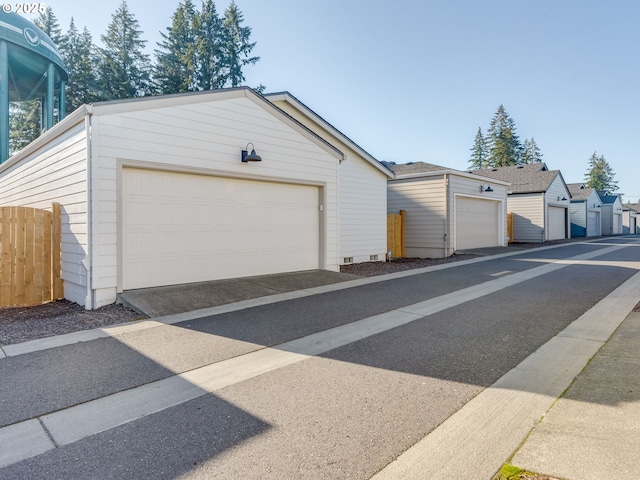 view of front facade with an outbuilding and a garage