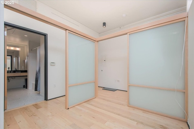 unfurnished room with light hardwood / wood-style flooring