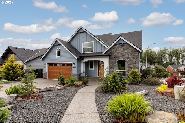34800 Westboro Way, Saint Helens, OR 97051 - craftsman-style home featuring board and batten siding, stone siding, driveway, and a shingled roof