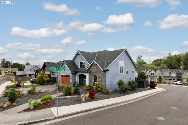 34800 Westboro Way, Saint Helens, OR 97051 - view of front of property with board and batten siding, stone siding, a residential view, a garage, and a shingled roof