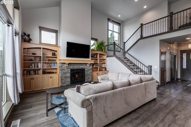 34800 Westboro Way, Saint Helens, OR 97051 - living area featuring a high ceiling, dark wood-style floors, a stone fireplace, recessed lighting, and stairs