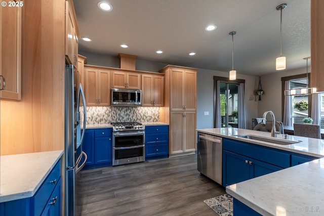 34800 Westboro Way, Saint Helens, OR 97051 - kitchen featuring appliances with stainless steel finishes, a sink, blue cabinets, tasteful backsplash, and recessed lighting