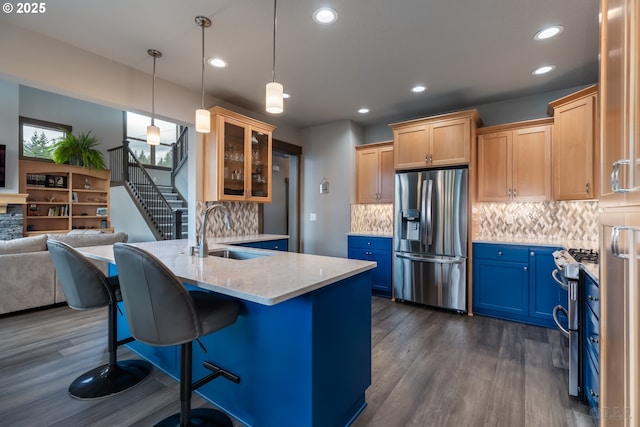 34800 Westboro Way, Saint Helens, OR 97051 - kitchen with stainless steel appliances, a sink, dark wood-style flooring, open floor plan, and glass insert cabinets