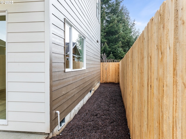 view of property exterior with fence