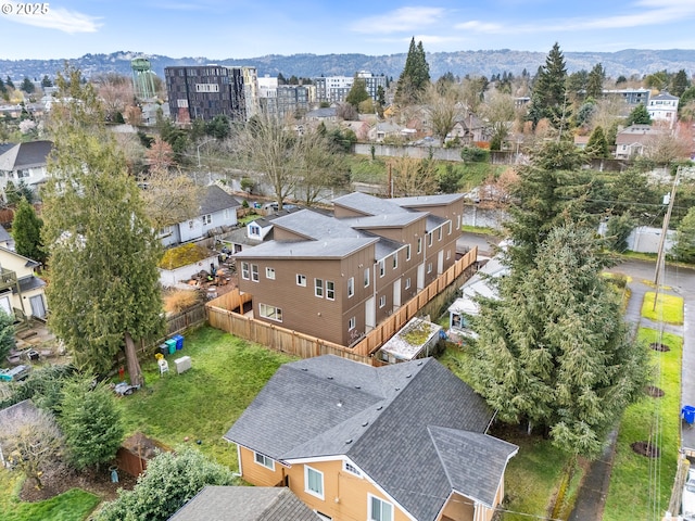 birds eye view of property with a mountain view and a residential view