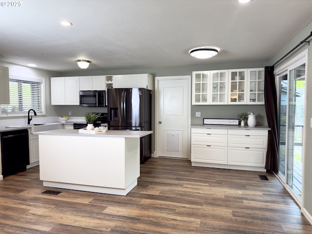 19795 SW Frances St, Beaverton, OR 97003 - kitchen featuring black appliances, glass insert cabinets, a sink, recessed lighting, and white cabinets