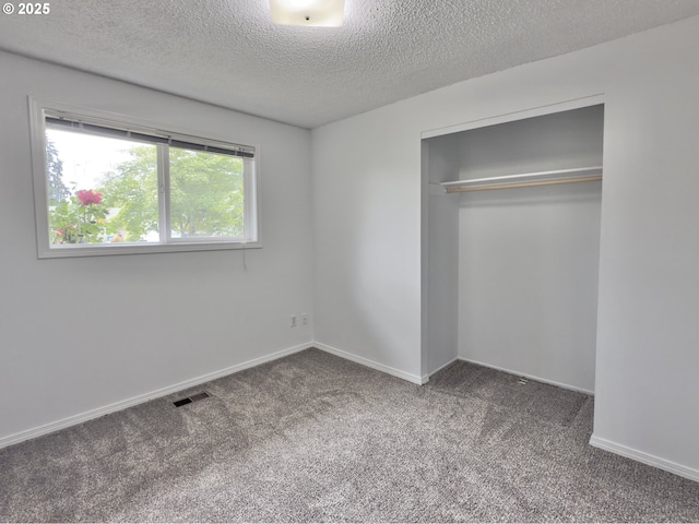 19795 SW Frances St, Beaverton, OR 97003 - unfurnished bedroom featuring carpet floors, a textured ceiling, a closet, and baseboards