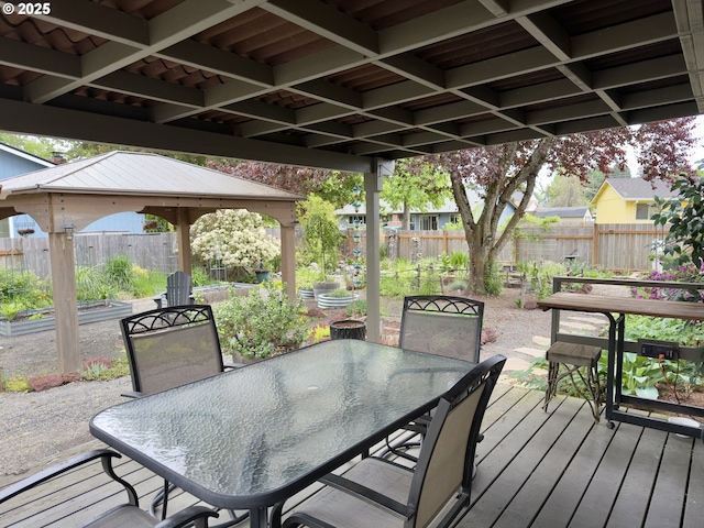 19795 SW Frances St, Beaverton, OR 97003 - wooden terrace featuring a gazebo, a fenced backyard, outdoor dining space, and a vegetable garden
