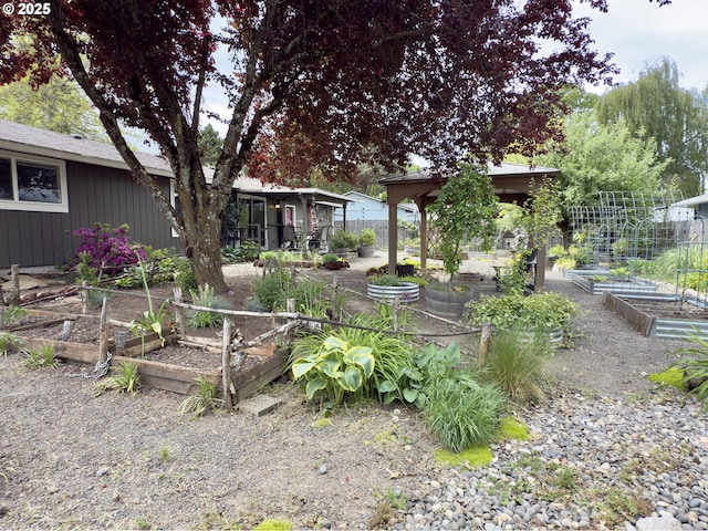 19795 SW Frances St, Beaverton, OR 97003 - view of yard with a vegetable garden, a gazebo, and fence