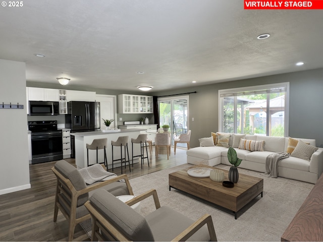 19795 SW Frances St, Beaverton, OR 97003 - living room featuring recessed lighting, wood finished floors, and baseboards